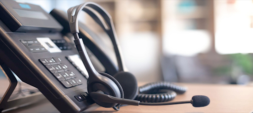 Professional desk phone and headset setup representing advanced VOIP services by Straight Edge Tech in Corpus Christi TX